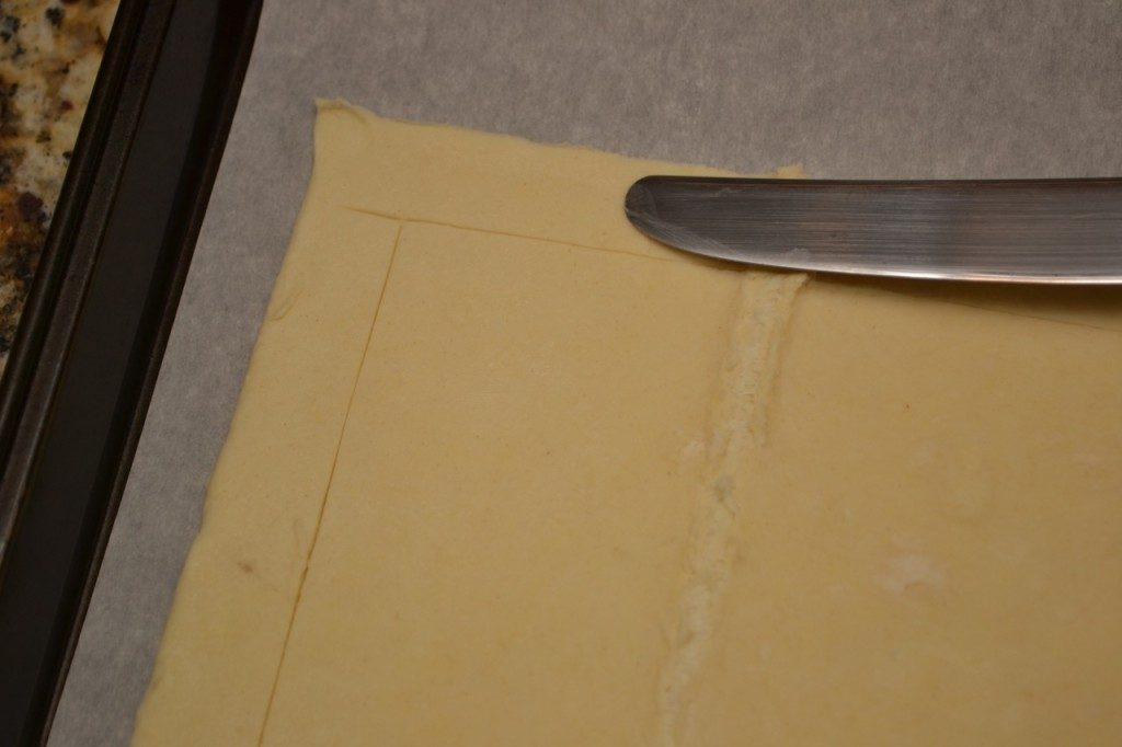Trace a 1 inch border around the dough